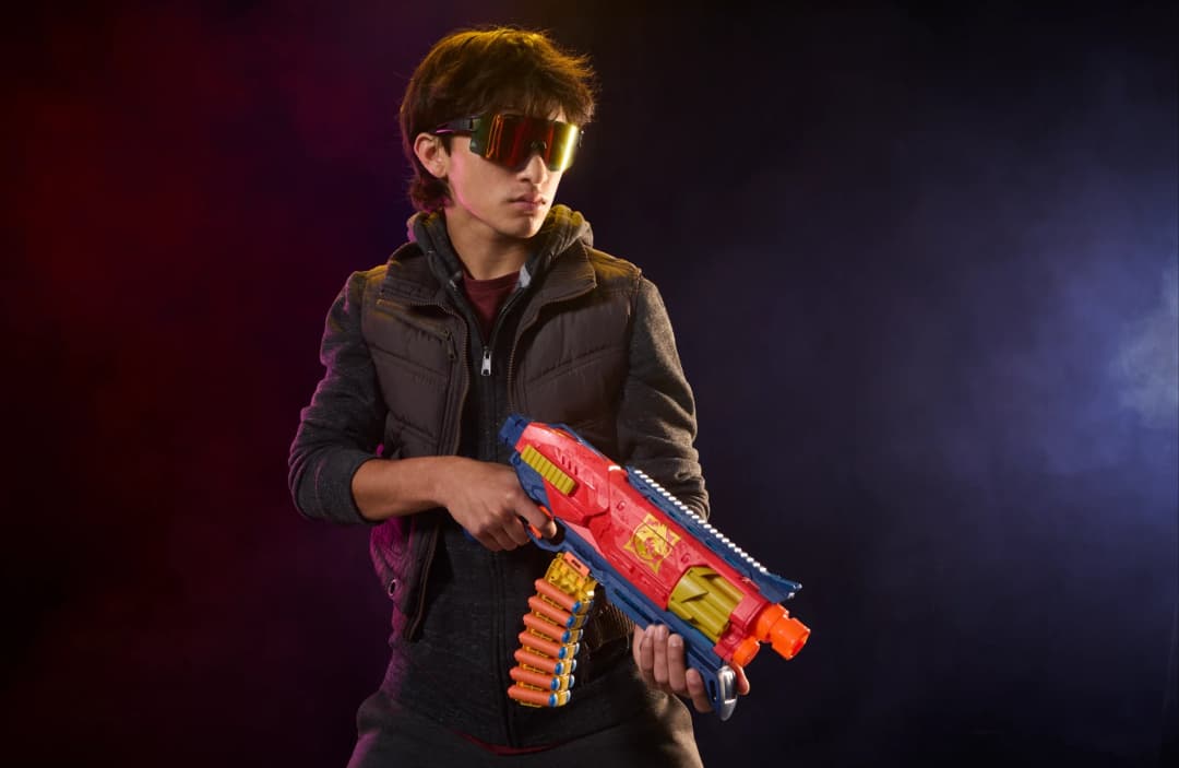 Kid playing with NERF Loadout blaster image