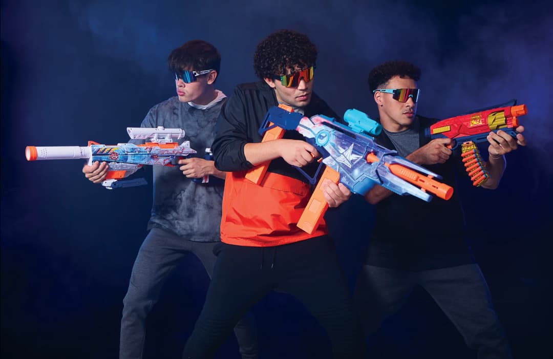 Group of teens playing with NERF Loadout blasters image